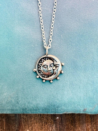 Embrace the beauty of the cosmos with our Moon and Sun Sterling Silver Pendant Necklace, a stunning piece of celestial-inspired jewelry that brings together the radiant energy of the sun and the calming influence of the moon. Crafted with care from high-quality sterling silver, this pendant necklace is perfect for those who appreciate unique, meaningful designs that connect them to the universe.